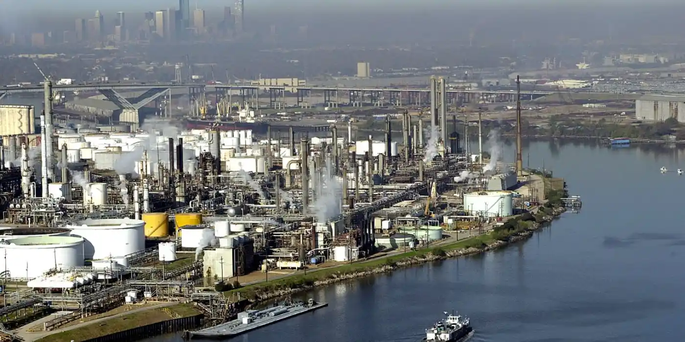 Industrial plants along the Houston Ship Channel with downtown Houston beyond